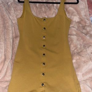 Orange dress with buttons tight fitting.